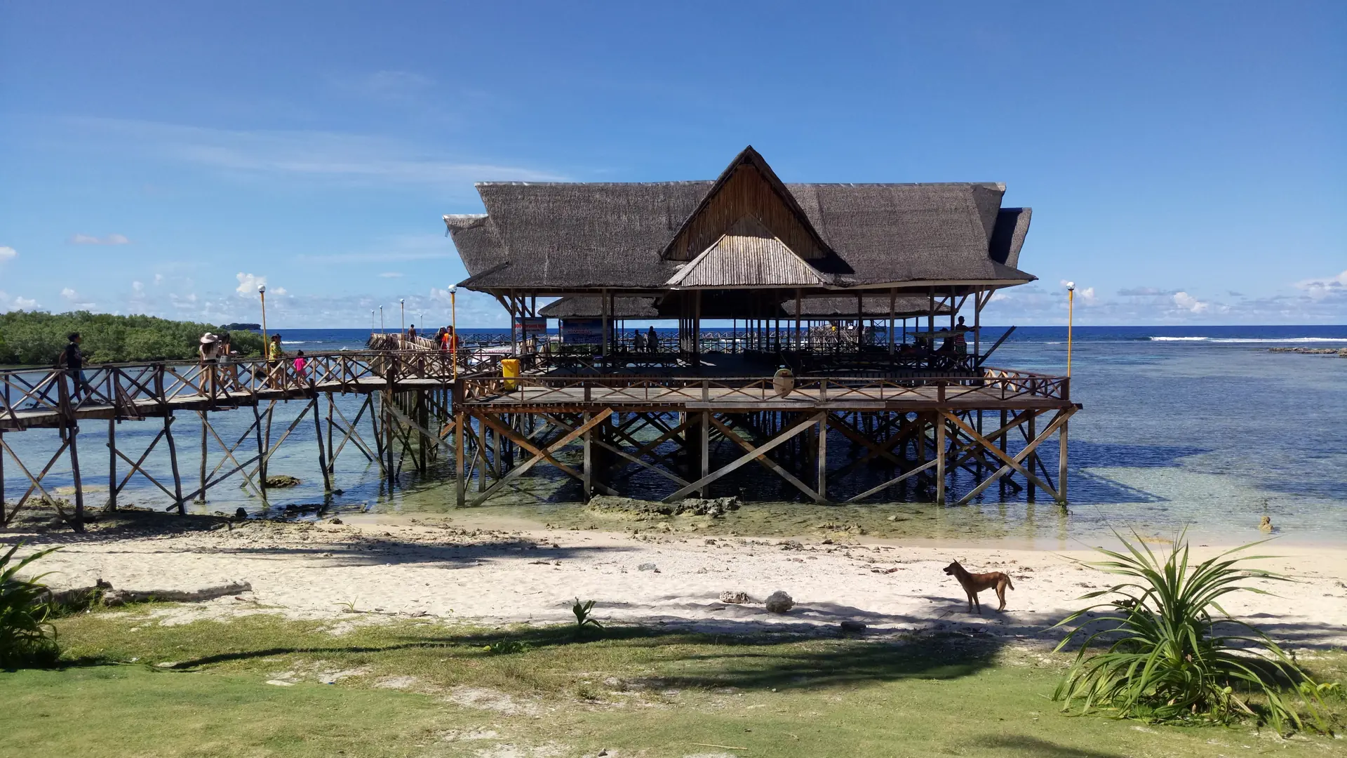 Thatched pavilion and wooden walkway at Cloud 9’s boardwalk above the reef, Siargao