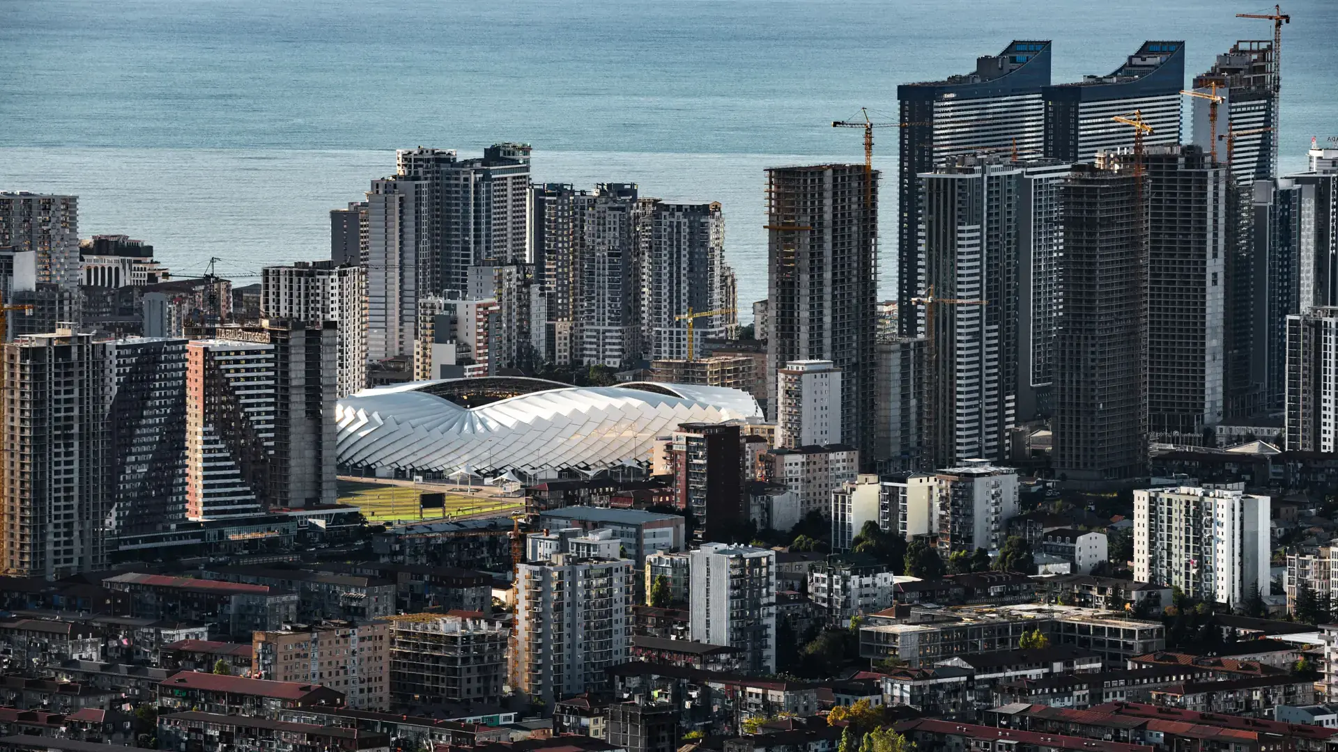Modern Trabzon buildings seen from above against the broad Black Sea horizon