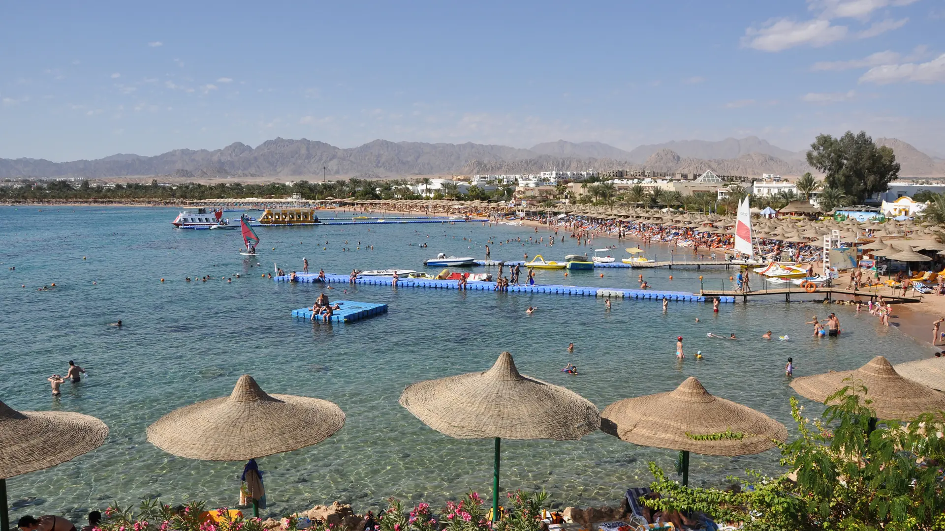 Sunny private beach and blue water at Naama Bay in Sharm El-Sheikh