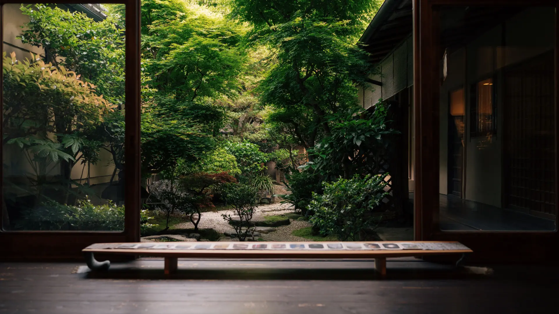 A serene private onsen terrace looking across wooded Hakone hills