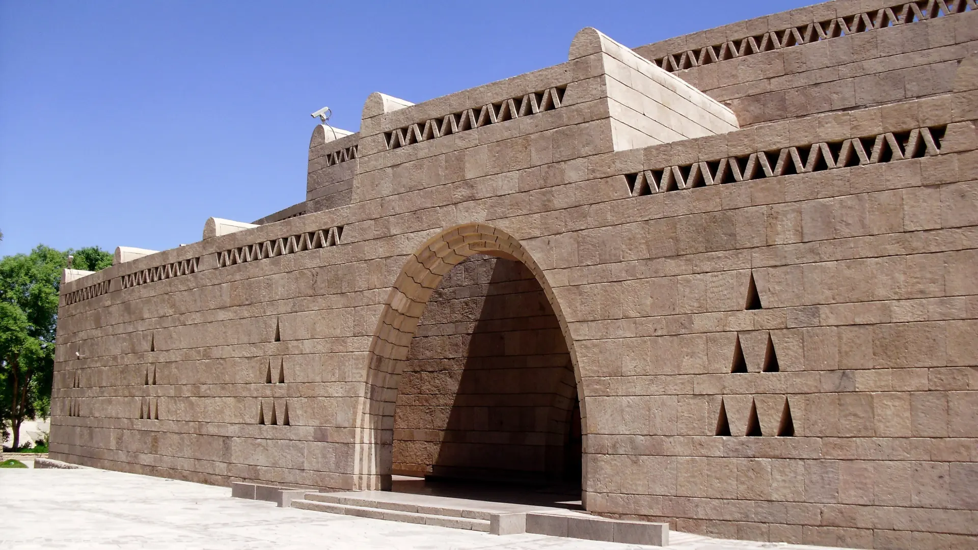 Sandstone entrance to Nubia Museum in Aswan under blue sky