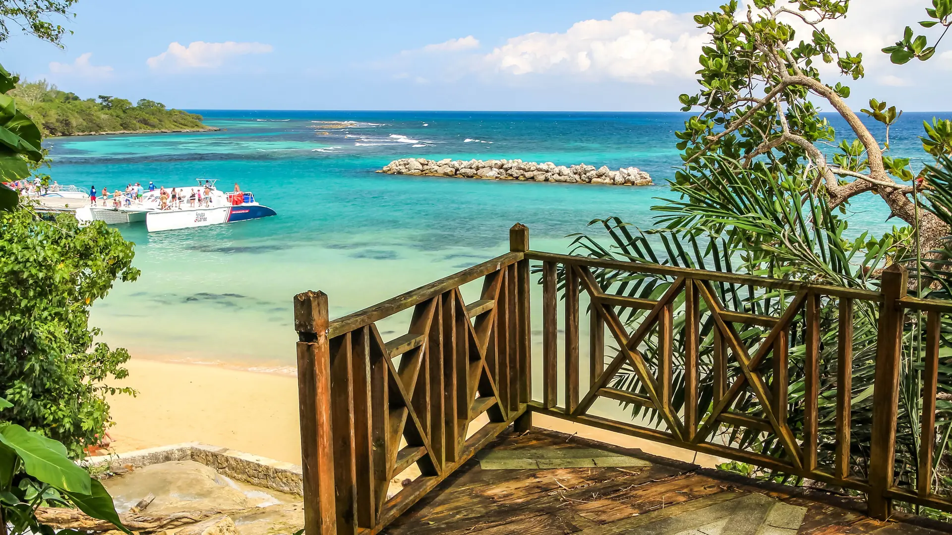 Wooden steps leading towards the beach at Dunn’s River Falls near Ocho Rios