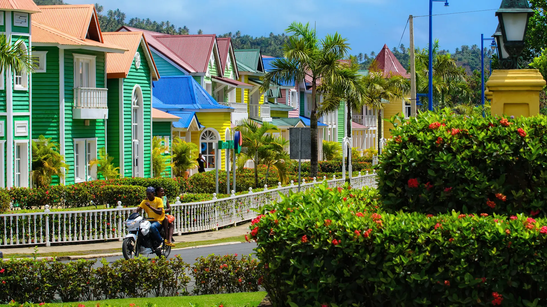 Colourful Pueblo Príncipe buildings and palms in sunlit Santa Bárbara de Samaná
