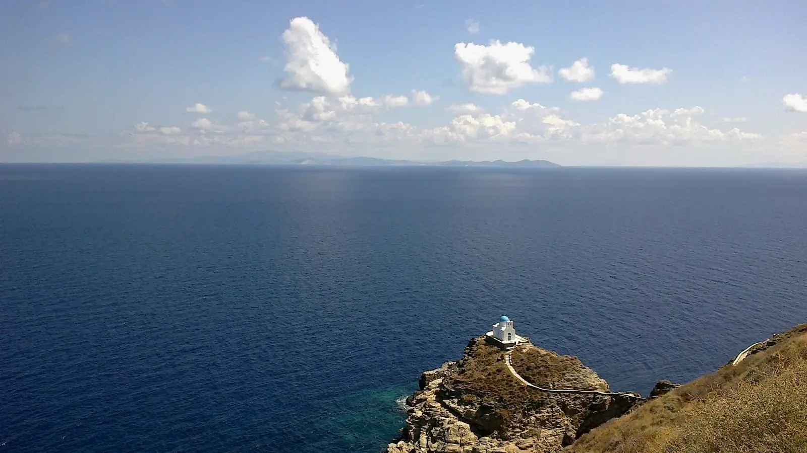 The tiny Seven Martyrs church on its rocky headland below Kastro, Sifnos