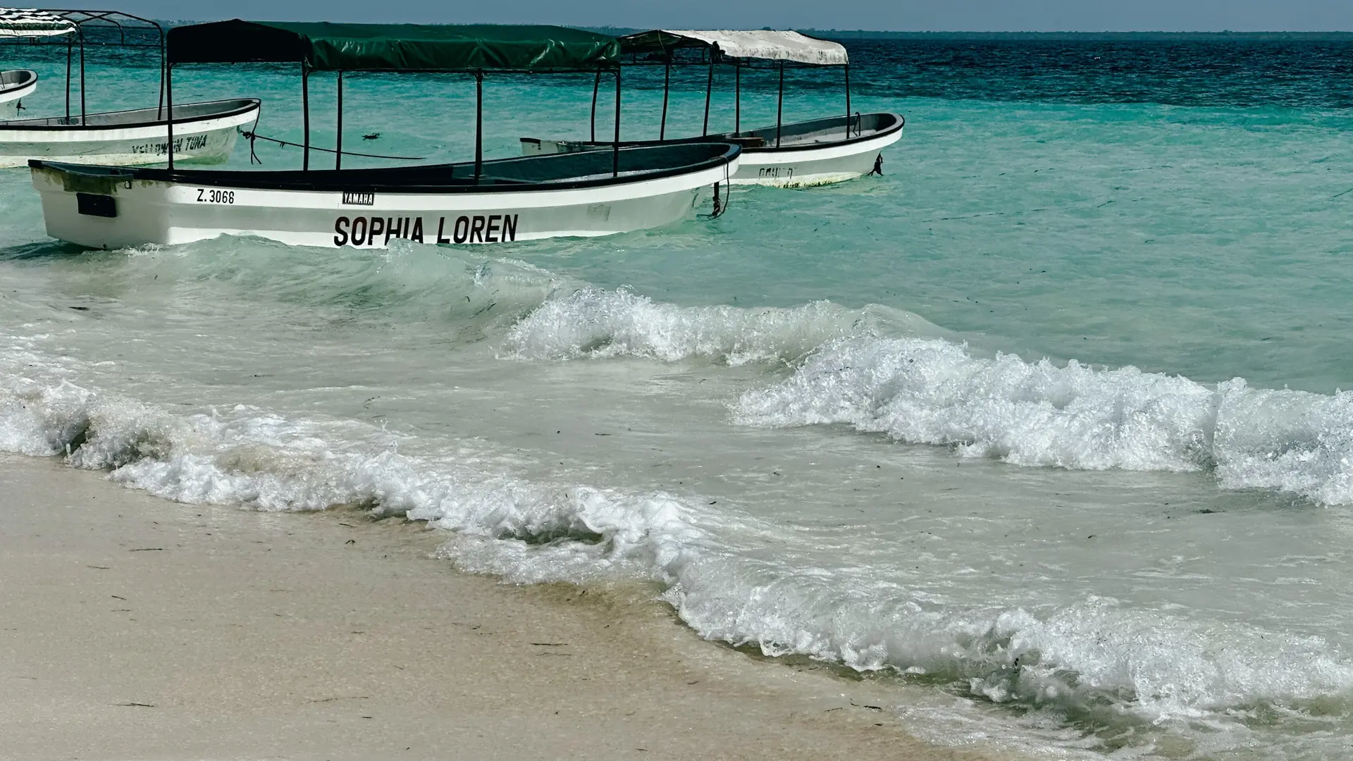 Sunny white sand and clear water on Zanzibar’s northern coast