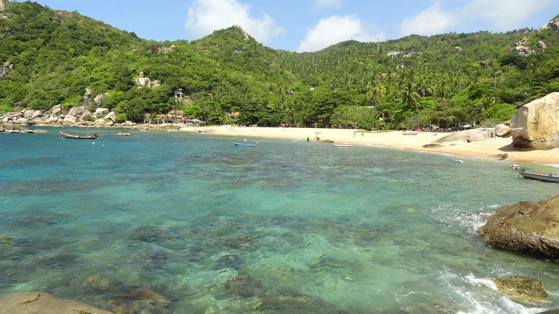 Clear water, sunny sand and granite boulders at Tanote Bay on Koh Tao