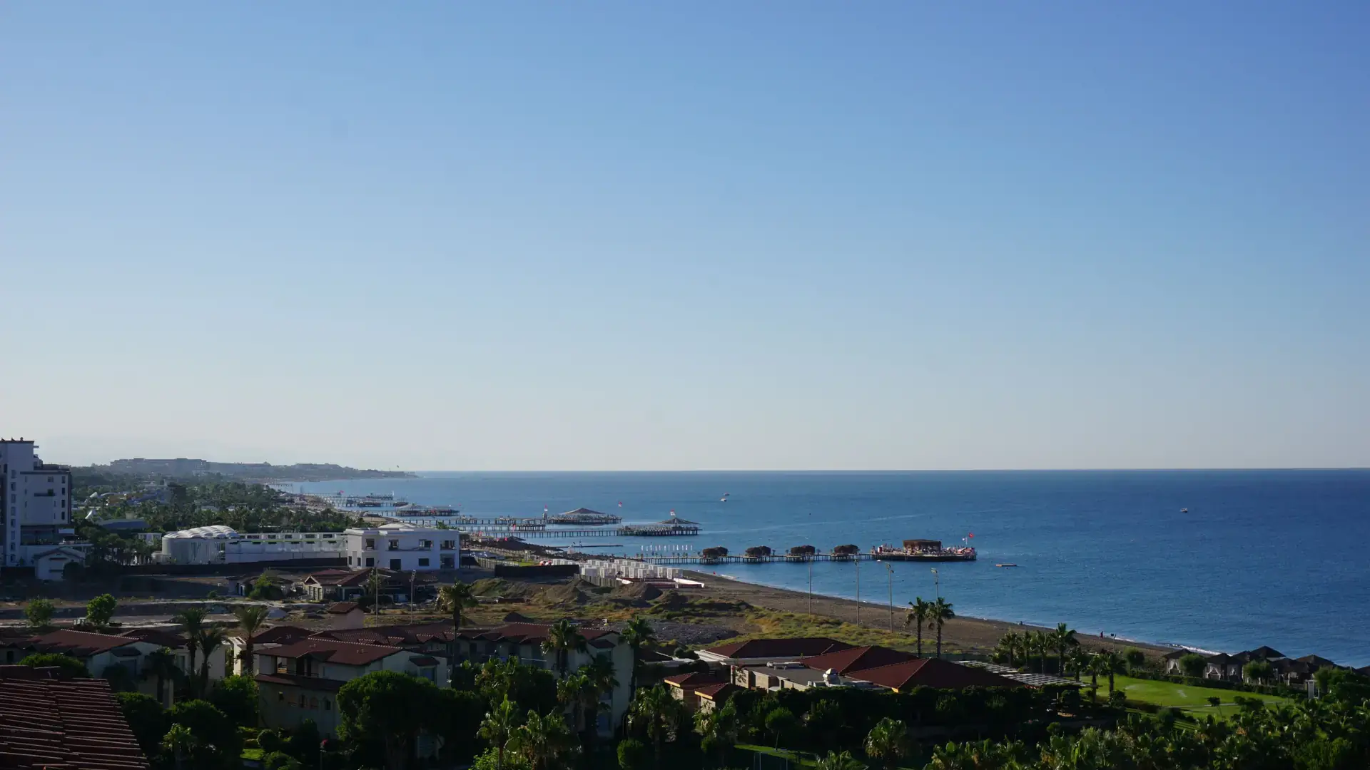 Green Turkish coastal landscape overlooking calm blue Mediterranean water