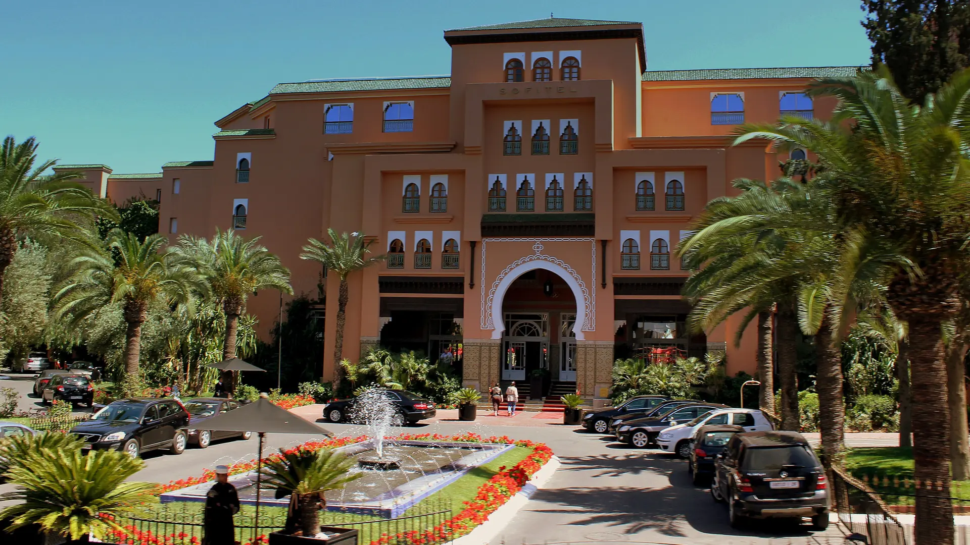 Flowered hotel approach and palms in Marrakech’s Hivernage district