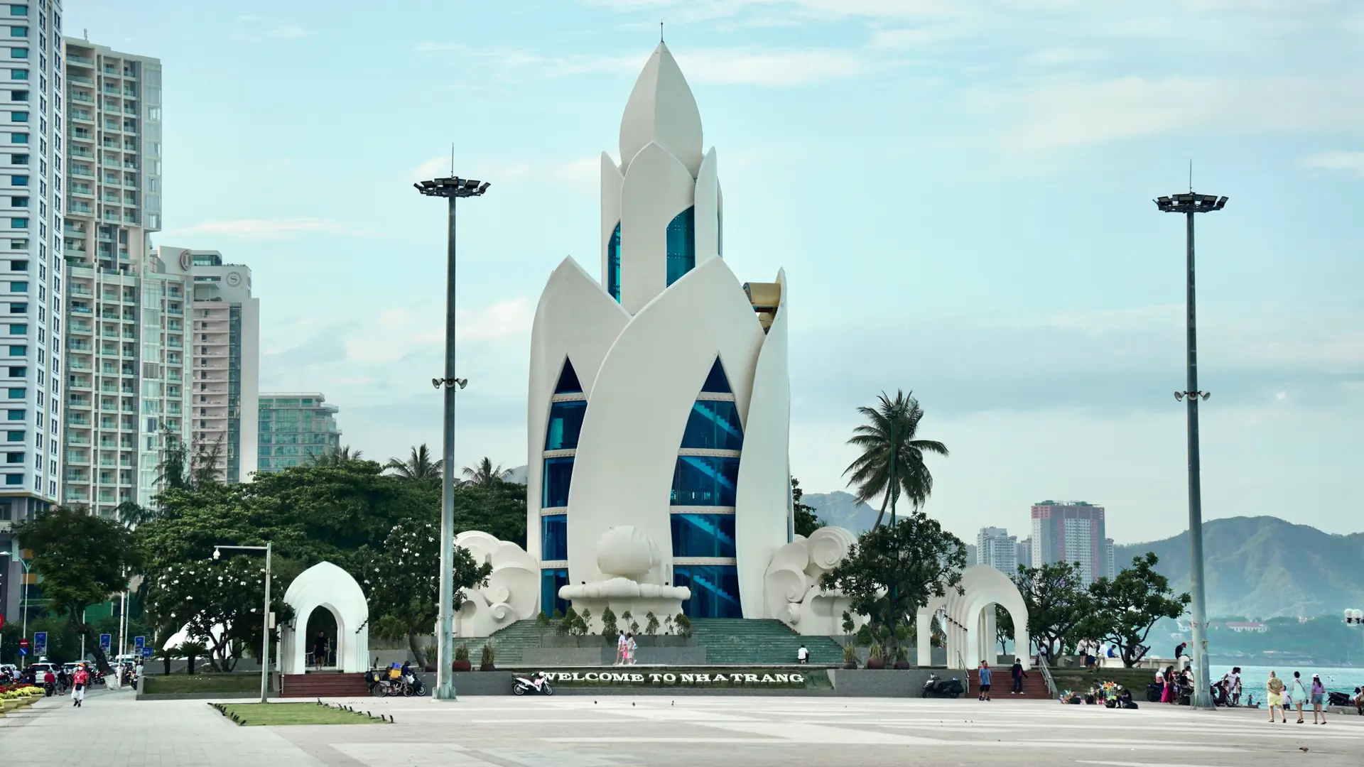 Tram Huong Tower beside Nha Trang central waterfront beneath a blue sky