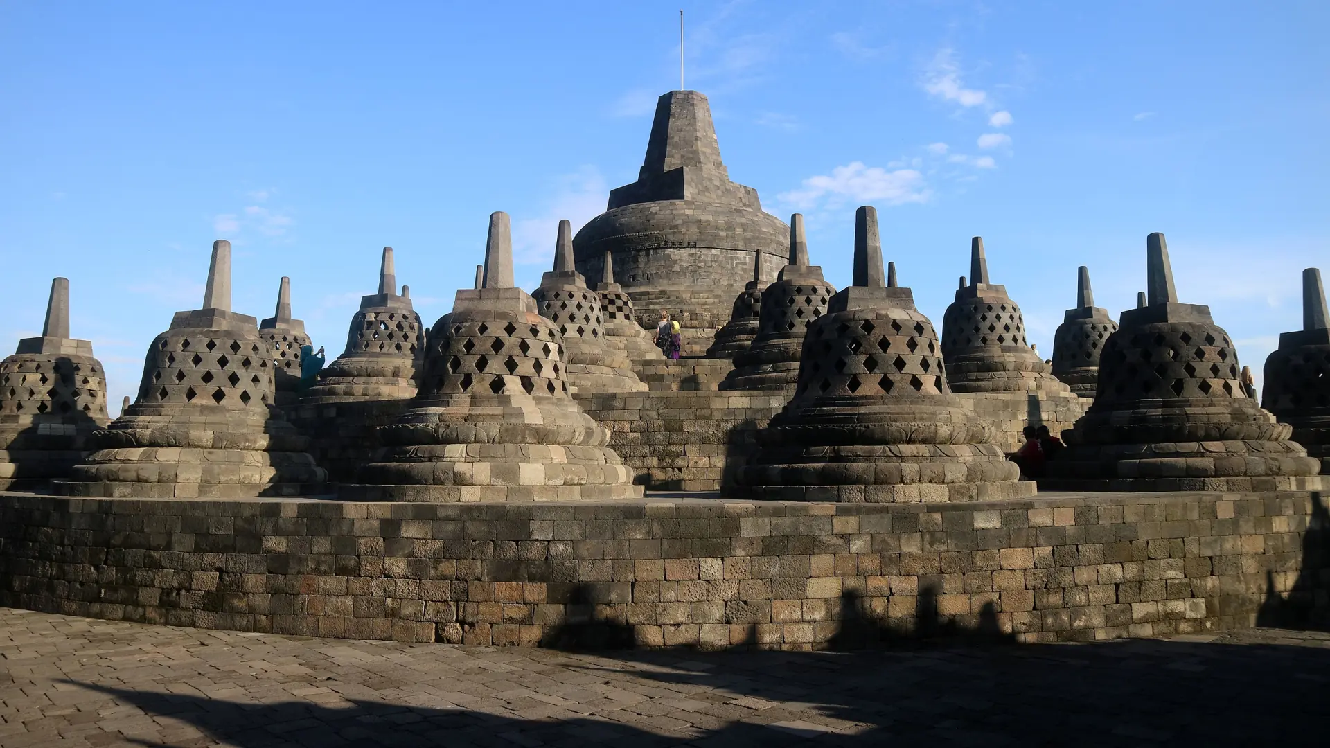 Sunlit stone stupas at Borobudur in Central Java