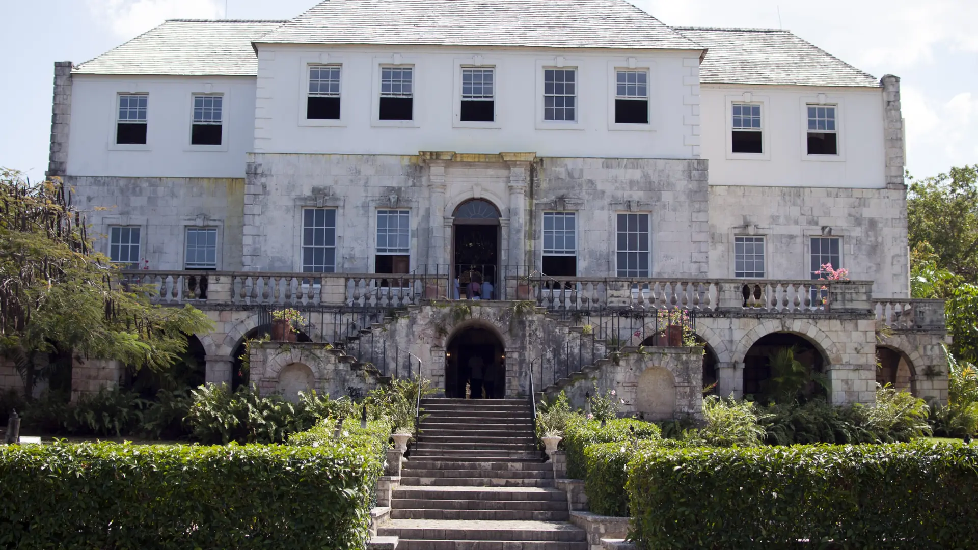 Rose Hall Great House with its stone steps and garden in daylight