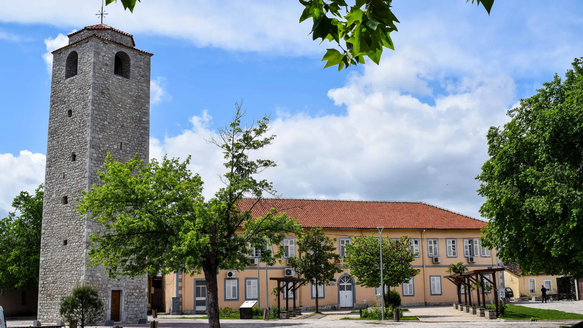 Podgorica Clock Tower in Stara Varoš beneath a blue sky