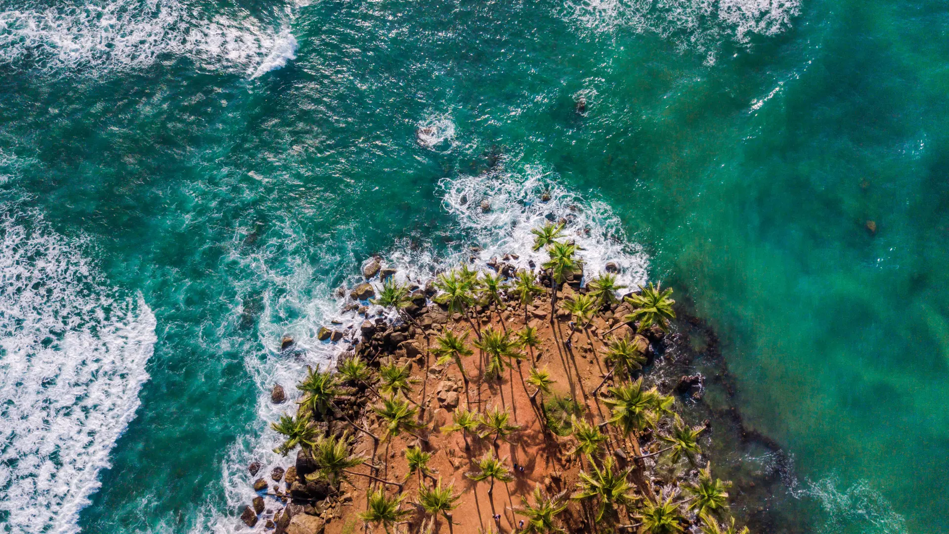 Aerial view of Coconut Tree Hill and turquoise water at Bandaramulla