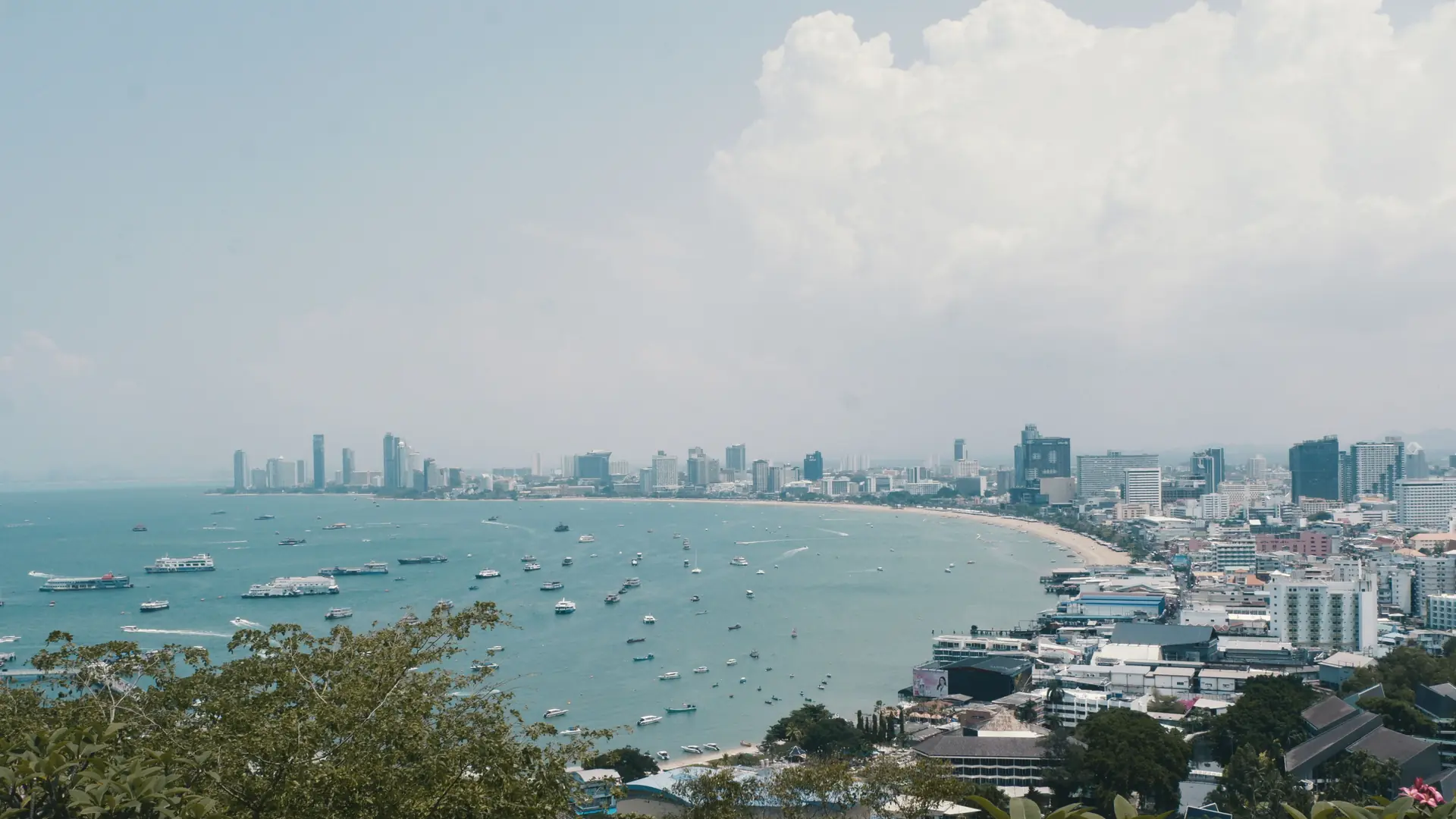 Aerial view over Pattaya's high-rises and curving Gulf shoreline