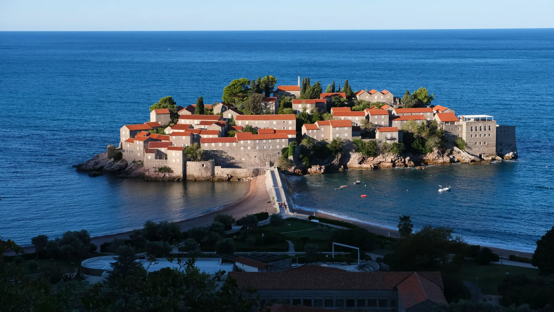 Sveti Stefan island and its narrow causeway viewed from the mainland