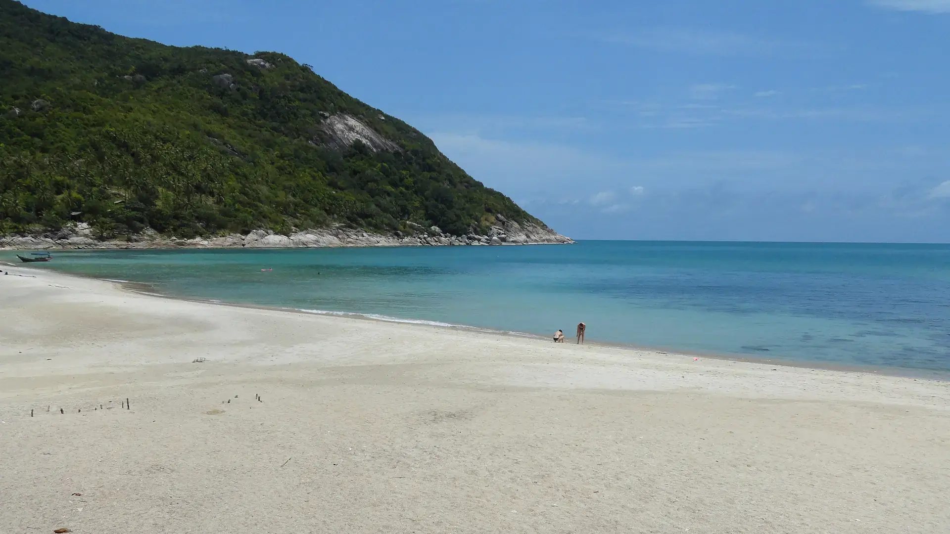Bottle Beach beneath green hills on Koh Phangan, a wider island view