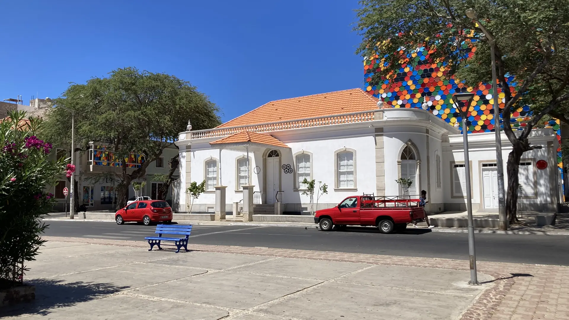 CNAD arts centre and tree-lined Praça Nova under a blue sky in Mindelo