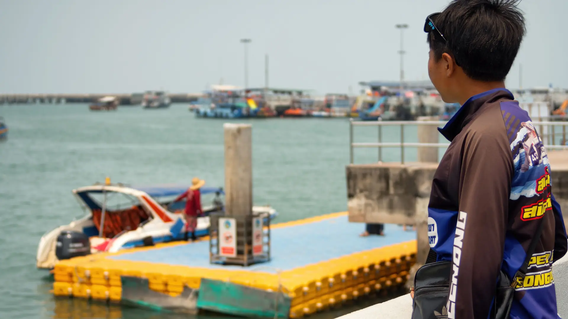 Boats and modern waterfront buildings at a marina south of Pattaya