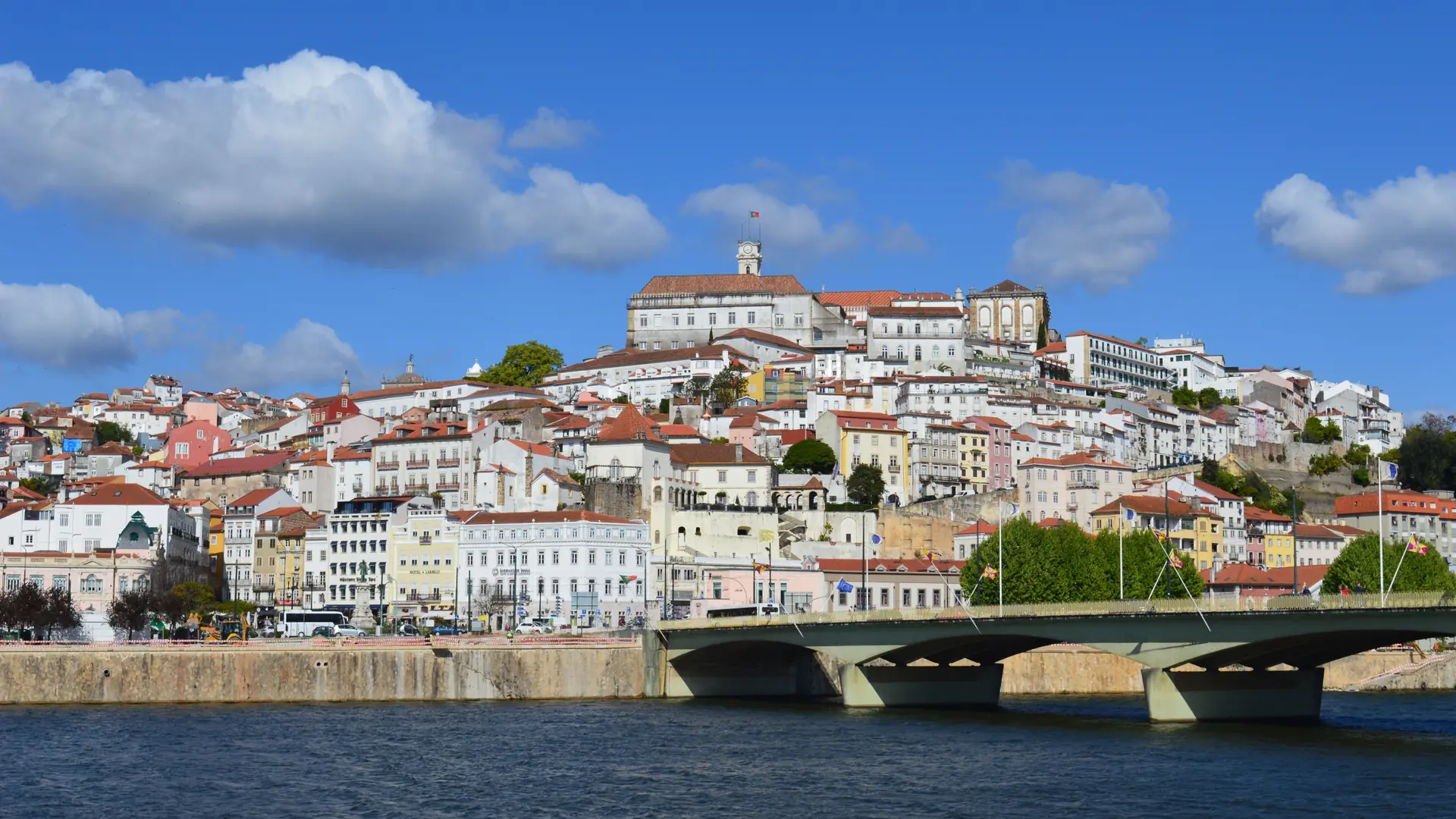 Coimbra’s historic hillside buildings seen across the Mondego River