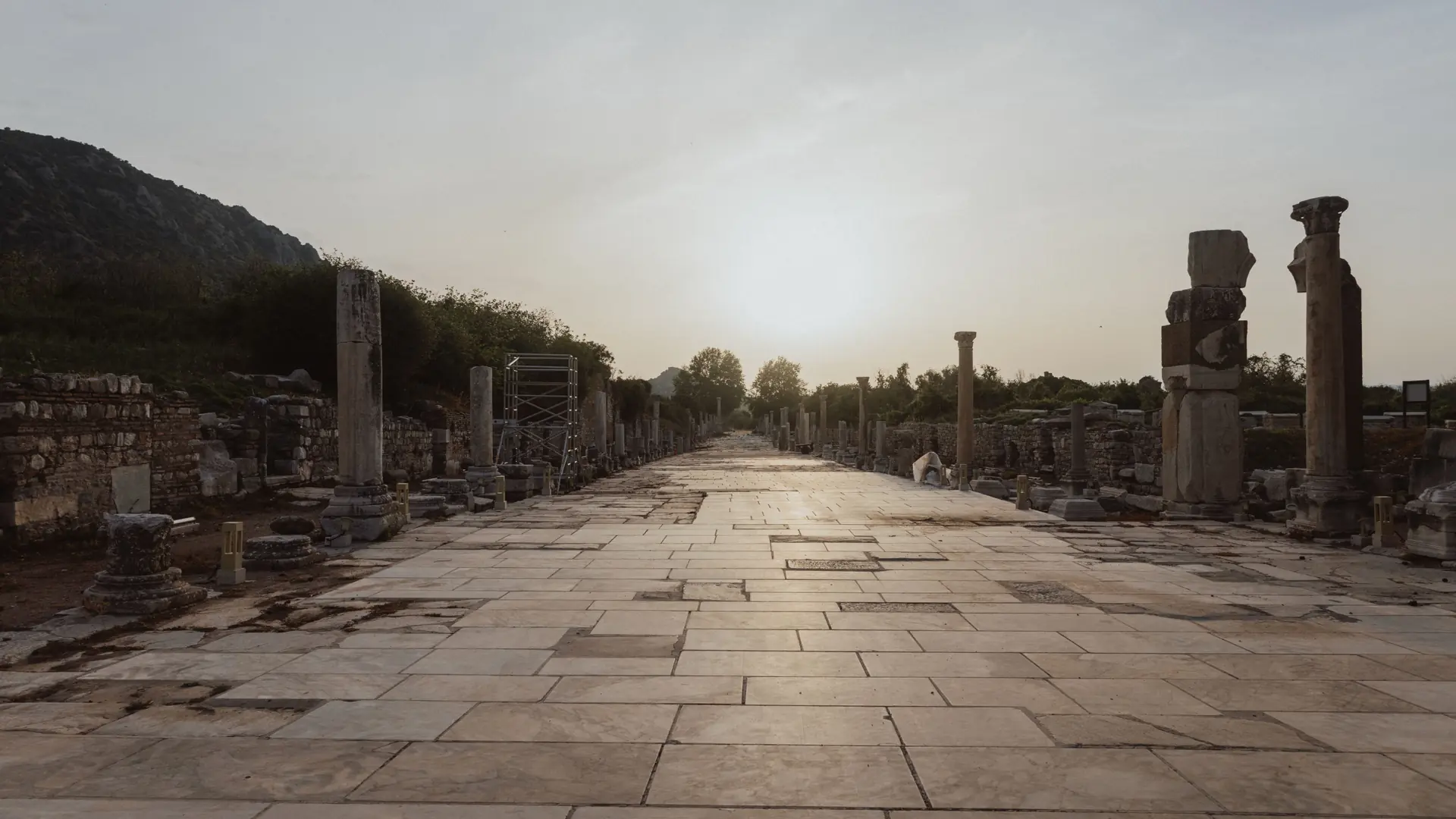 Marble street and ancient columns at Ephesus in late-afternoon light