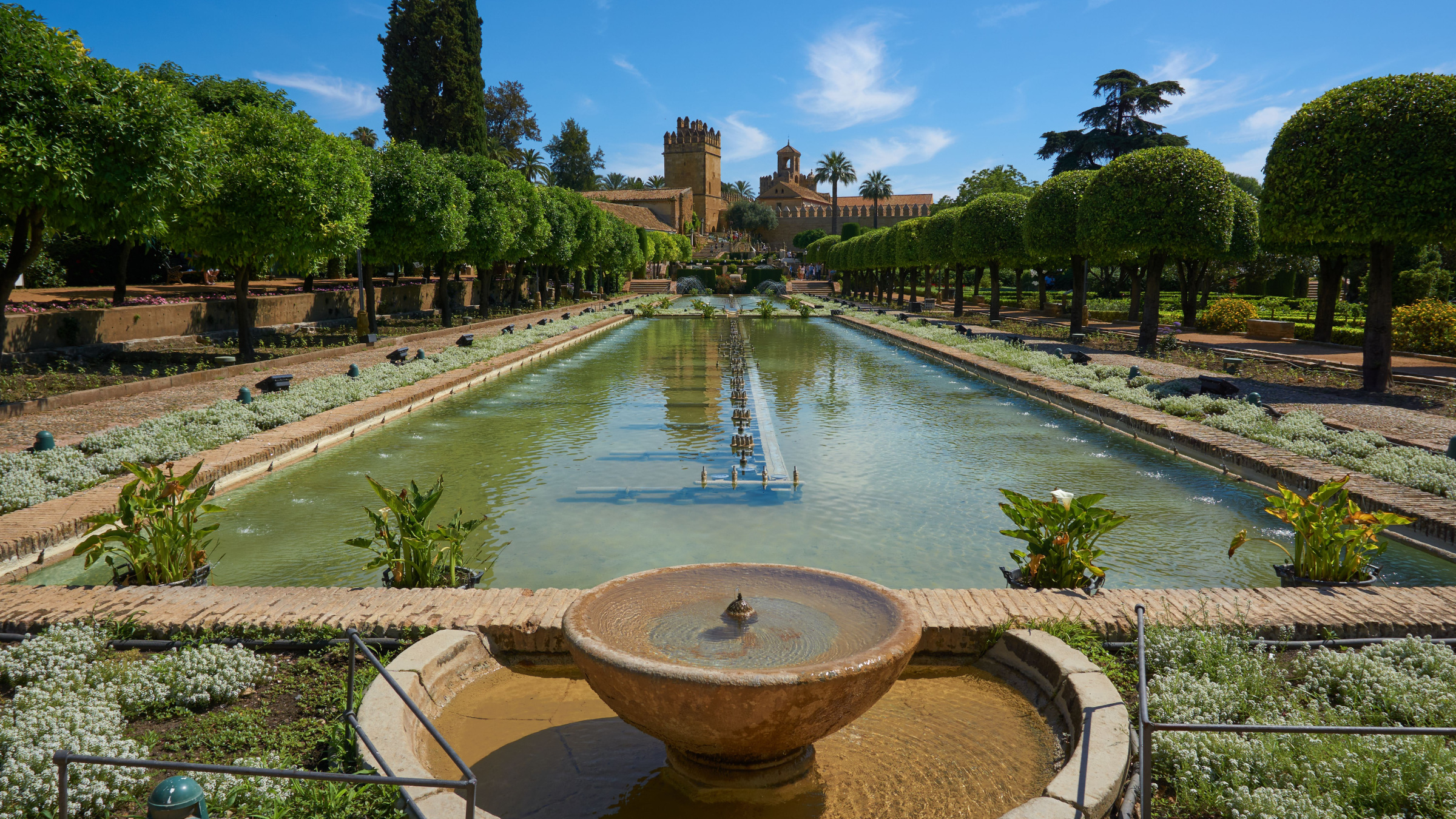 Sunlit pools and cypress trees in the gardens of Córdoba’s Alcázar de los Reyes Cristianos